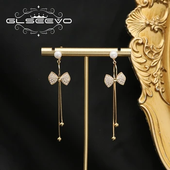 GLSEEVO Длинные жемчужные серьги для женщин, богемные серьги с золотой бантиковой кисточкой, серьги с жемчугом в стиле Ретро, легкие блестящие серьги с цирконием Изображение